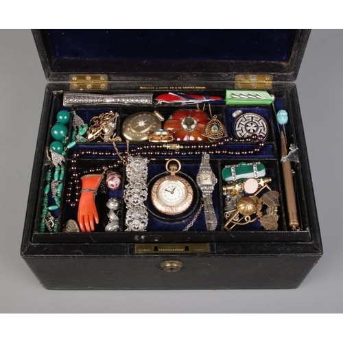 576 - A Parkins and Gotto (Oxford Street) multi-layer jewellery box containing an extremely large quantity... 