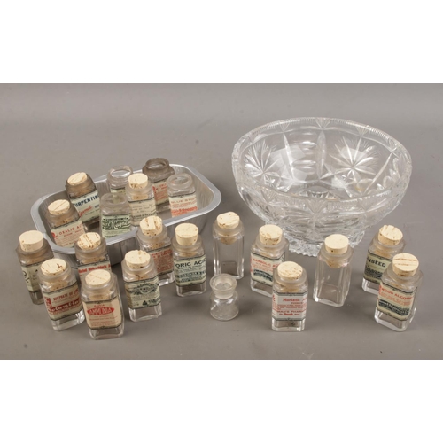 53 - A cut glass bowl and tray with contents of reproduction acid/poison bottles.