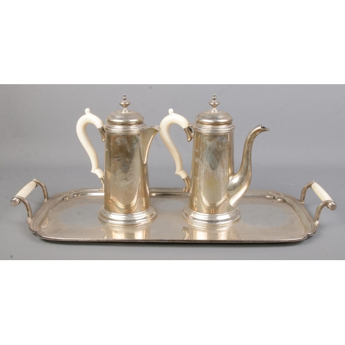 1 - Withdrawn from Sale  A George VI silver three part coffee set. Includes tray, coffee pot and hot wat... 
