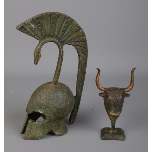 101 - Two miniature bronze sculptures to include Trojan centurion helmet and bust of a bull's head mascot.... 