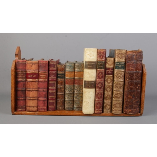 150 - An oak book trough with contents of 19th century books. Includes Charles Dickens, William Shakespear... 