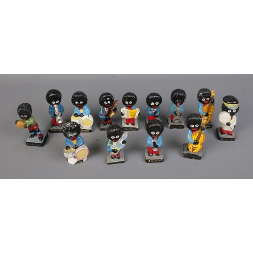 164 - A collection of assorted Robertson Golly figures includes mostly musicians along with football playe... 