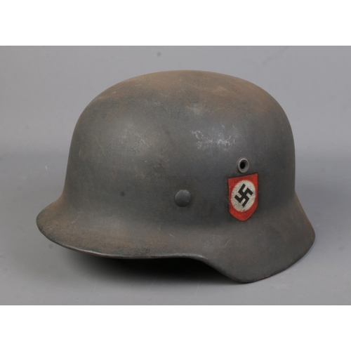 168 - A German World War Two M40 steel helmet.
