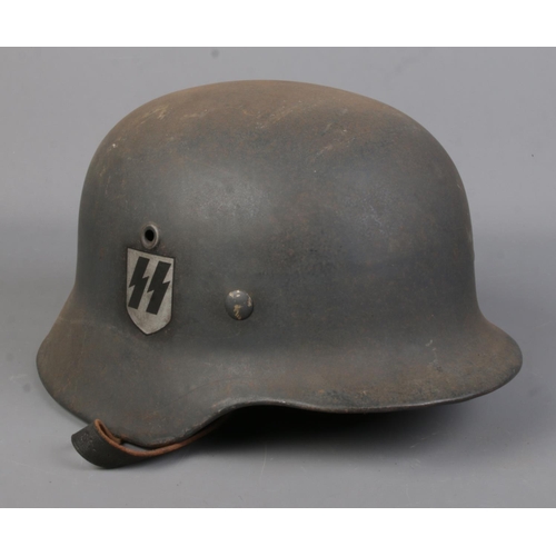 168 - A German World War Two M40 steel helmet.