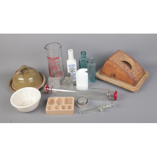 27 - A collection of kitchen ceramics and glassware to include ceramic chocolate mould, glass rolling pin... 