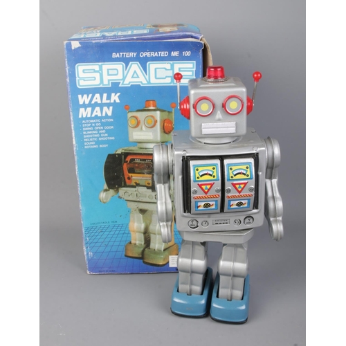 30 - A boxed battery operated Homme Marchantade Space Walk Man.