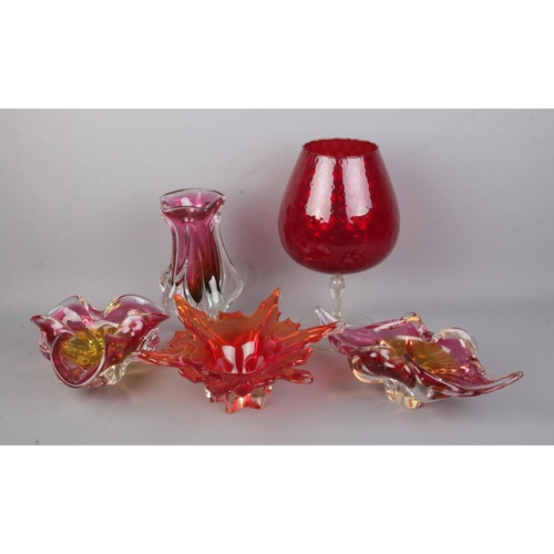 224 - A collection of assorted art glass bowls and vases to include leaf shaped example.