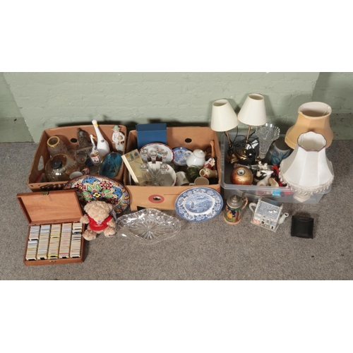 228 - Three boxes of miscellaneous items, to include table lamps, West German Stein, large charger, animal... 