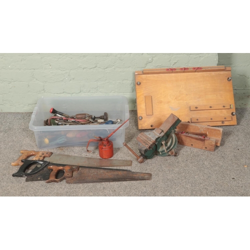 280 - A collection of assorted tools to include hand saws, screwdrivers, clamp, oil can, etc.