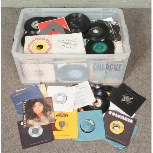 285 - A box of single records. Including Cindy Lauper, Tom Jones, Pet Shop Boys etc.