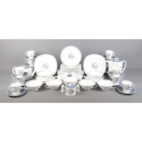 46 - A comprehensive Susie Cooper Glen Mist dinner service. Containing cups and saucers, plates, salt and... 