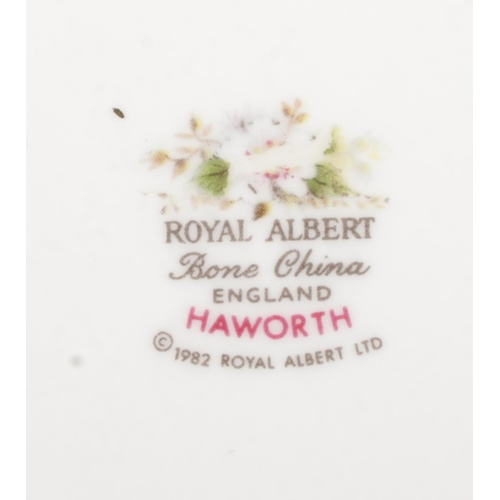 50 - A collection of Royal Albert dinnerwares in the Haworth pattern. To include cups and saucers, servin... 