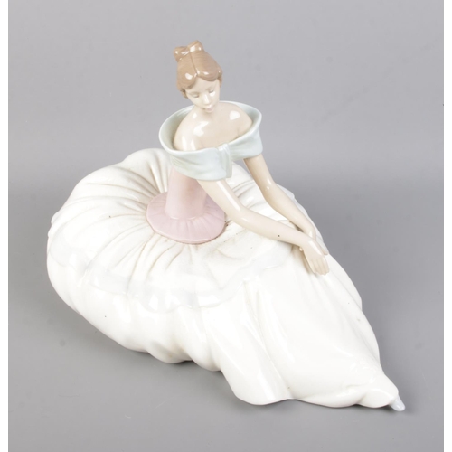 62 - A Nao ceramic figure titled Hope depicting a seated ballet dancer. Impressed number 1266.