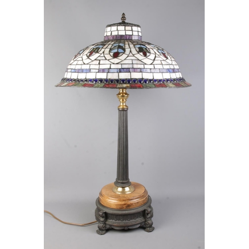 65 - A large Tiffany style table light, with Corinthian style column mounted on wooden base, raised on me... 