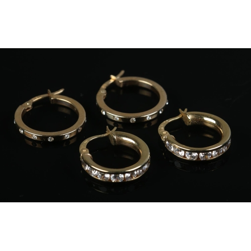 464 - Two pairs of 9ct gold paste set hoop earrings. 4.1g.