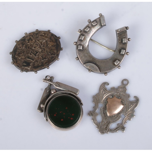 466 - Four silver items. Includes cricket bat swivel fob, horse shoe and Mizpah brooches and another fob.