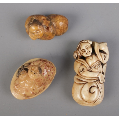 467 - A collection of Japanese Netsukes to include carved bone and two composite examples.