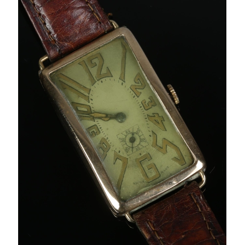 486 - A circa 1920's rolled gold wristwatch featuring oblong face and subsidiary dial.