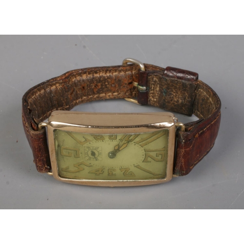 486 - A circa 1920's rolled gold wristwatch featuring oblong face and subsidiary dial.