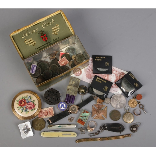 487 - An Army Club tin with contents of collectables and jewellery oddments. Includes Ten Shilling note, 9... 