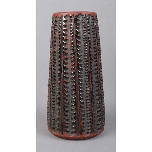 490 - A Poole Pottery Atlantis vase of cylindrical form. Designed by Catherine Connett. Height: 20.5cm.