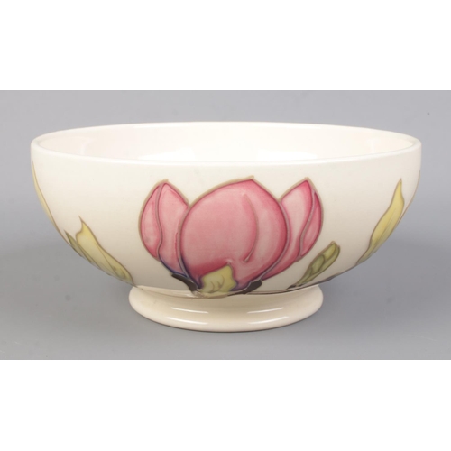 495 - A Moorcroft pottery bowl with footed rim, in the magnolia pattern. Date cypher for 1996. Diameter of... 