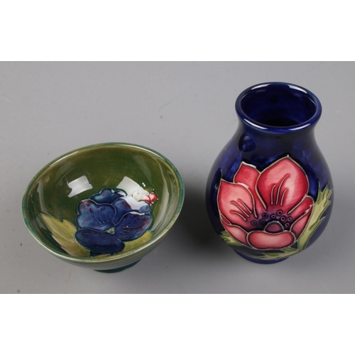 498 - Two pieces of Moorcroft pottery to include small vase in the Anemone pattern and footed bowl in the ... 