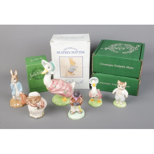 499 - A collection of ceramic Beatrix Potter Peter Rabbit figures to include several boxed Beswick example... 