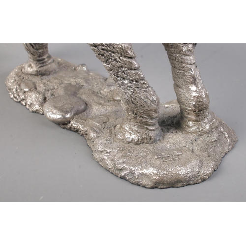 506 - A detailed silver filled model of an African Elephant, by Country Artists, set on naturalistic base.... 