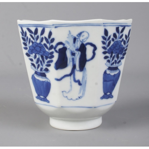 507 - A 19th Century Chinese blue and white cup of octagonal form, depicting plants and figures. Bears con... 