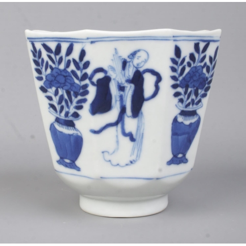 507 - A 19th Century Chinese blue and white cup of octagonal form, depicting plants and figures. Bears con... 