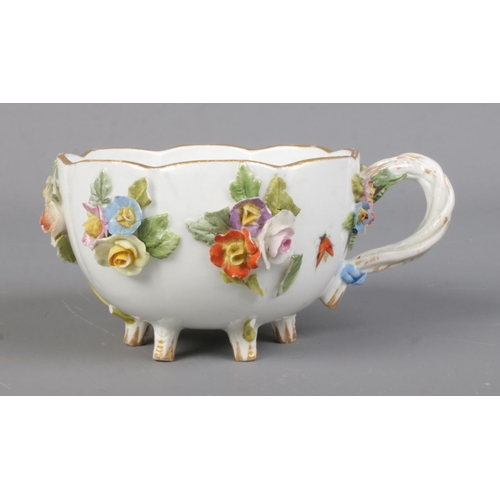 514 - A late Nineteenth Century Meissen cabinet cup, with rope twist handle, decorated with sprigs, foliag... 