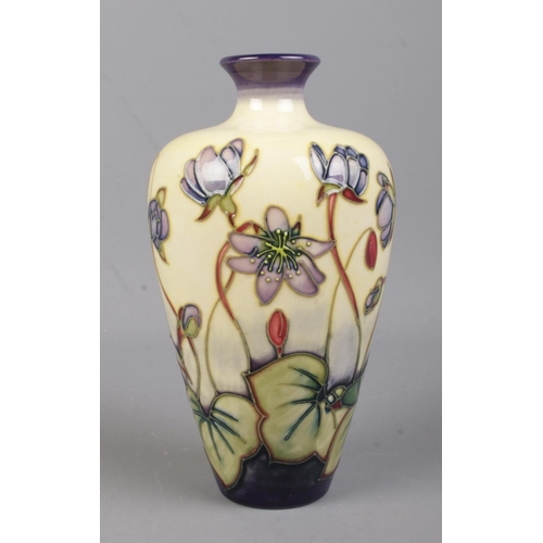 526 - A small Moorcroft Pottery narrow neck vase, in the Ashwood Hepatica pattern. Bearing date cipher for... 