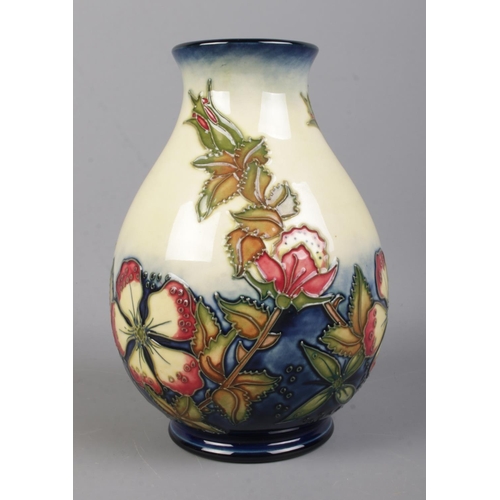 528 - A Moorcroft Pottery vase decorated in the 'Sweet Briar' pattern, designed by Rachel Bishop. Bearing ... 