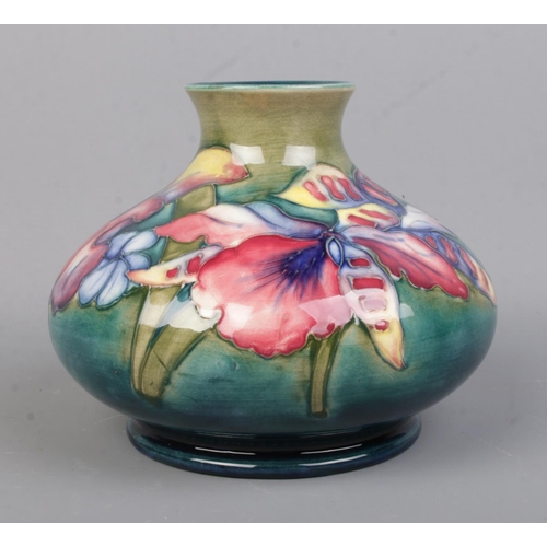 531 - A Walter Moorcroft (1947-53) Potter squat vase, in the Orchid pattern. Bearing signature and impress... 