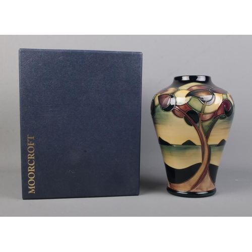 533 - A boxed Moorcroft vase, decorated in the Western Isles pattern. Bearing Seahorse stamp for designer ... 