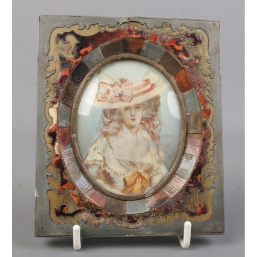 534 - An antique portrait of a maiden in tortoiseshell inlaid frame. Signed Pirot. Frame measures 13cm x 1... 