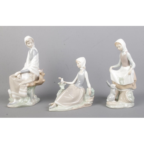 537 - Three Lladro ceramic figure groups, including 'Rabbit's Food', Shepherdess (No. 4660) and Sitting Sh... 