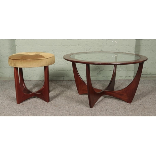 577 - A G-Plan Astro coffee table, designed by Victor Wilkins, with glass top, together with similar stool... 