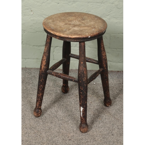 591 - An antique turned hardwood stool.