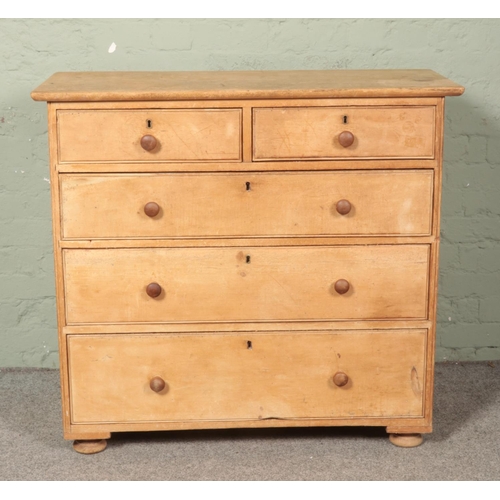 597 - A Victorian pine chest of two over three drawers.