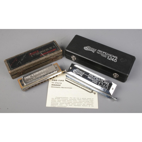 89 - Two cased harmonicas. Includes Hohner Super Chromonica and Huang Professional 1248.
