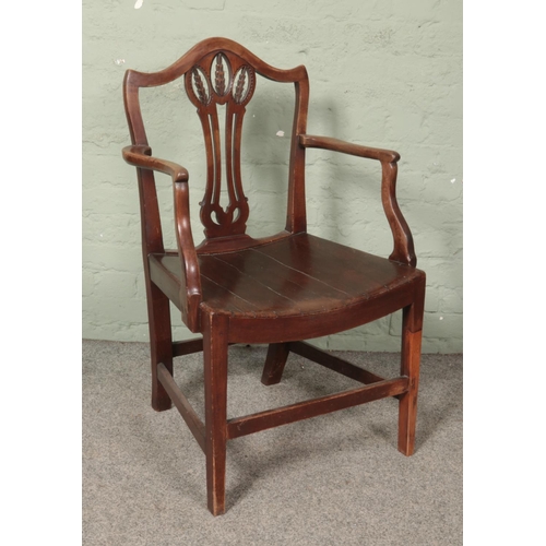 598 - A Georgian mahogany elbow chair, with barrel base and wheat splat.