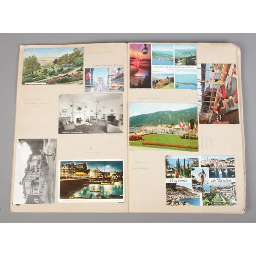 90 - Two nearly full vintage scrap books containing a large collection of souvenir postcards and photogra... 