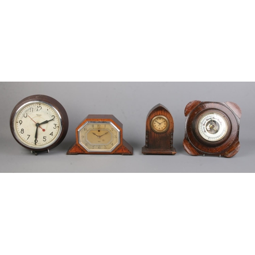 93 - Three clocks together with a small oak wall mounted barometer. To include Smiths Sectric and Precist... 