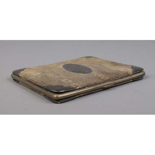 525 - A Victorian silver mounted snakeskin pocket cigar case. Assayed Birmingham 1894. 14cm x 12cm.
cannot... 