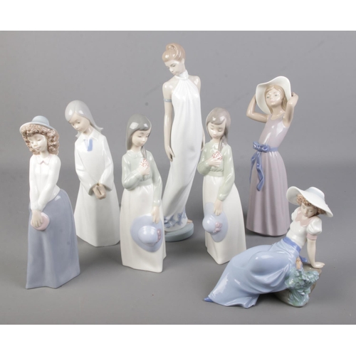 129 - A collection of seven Lladro by Nao figurines.