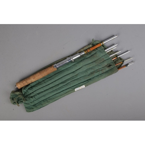130 - A vintage 8 piece fly rod with cork handle in travel bag.