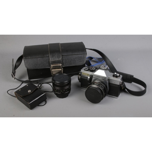 145 - A vintage Praktica Nova II camera with travel case and accessories