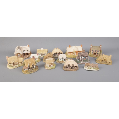 16 - A collection of Lilliput lane and other similar figures including Ostlers Keep, Riverview, April Cot... 